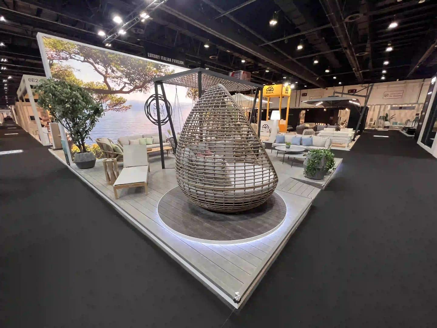 Wide-angle view of a trade show floor with exhibition booths and aisles