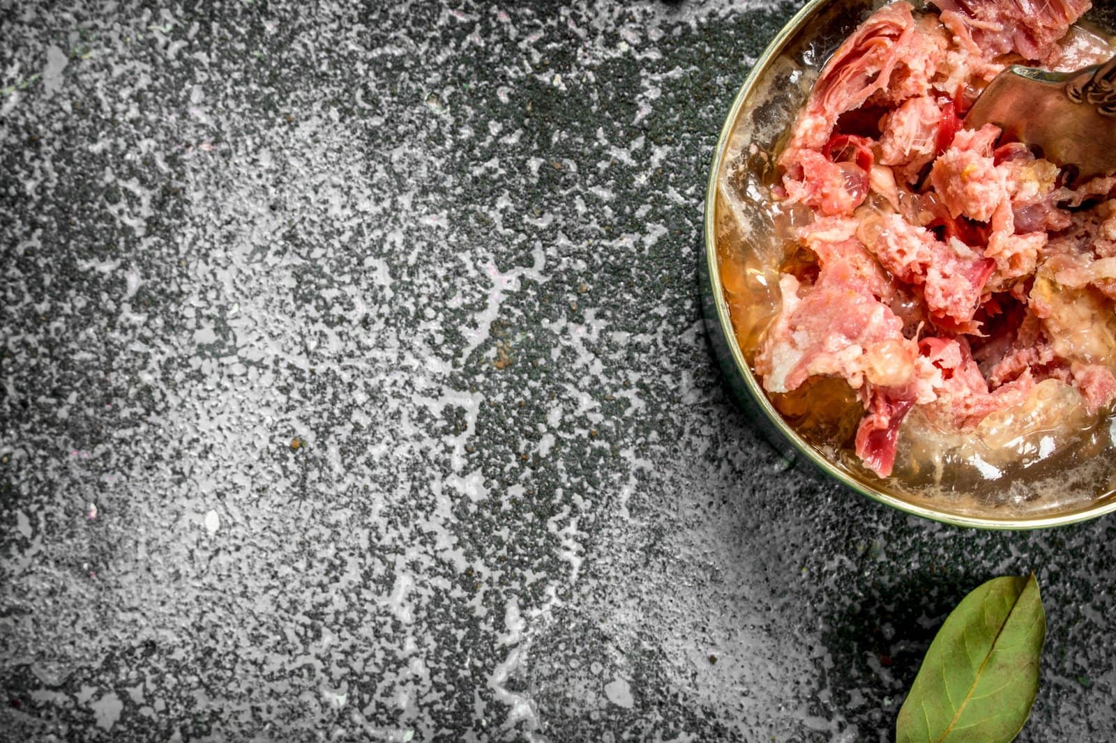 Canned meat in a tin can.